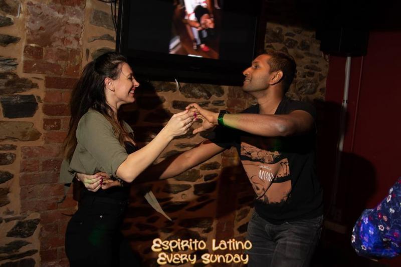 lady doing spin during salsa dance at latin night
